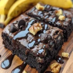 Imagine a dessert that combines the rich, chocolaty goodness of brownies with the comforting flavors of banana bread. Enter Banana Bread Brownies – a delectable fusion that is quickly capturing the hearts (and taste buds) of dessert lovers everywhere. This innovative recipe not only satisfies your sweet cravings but also brings a unique twist to two beloved treats. The growing popularity of banana-based desserts is no surprise, with many home bakers discovering the versatility of ripe bananas in various recipes. Banana Bread Brownies stand out in this trend for their simplicity, deliciousness, and their ability to bring joy to any occasion, whether it's a casual family gathering or a festive celebration.