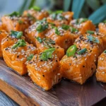 Salmon has secured its place as a beloved protein in kitchens around the world, thanks to its rich flavor and versatility. Whether grilled, baked, or seared, salmon can be transformed into a myriad of dishes that appeal to a wide range of palates. Today, we invite you to discover a mouthwatering twist on this classic fish: Sizzling Hot Honey Salmon Bites. This recipe harnesses the power of hot honey, a trend that has taken the culinary world by storm, merging sweetness with a spicy kick, creating a dish that’s as delightful as it is easy to prepare.